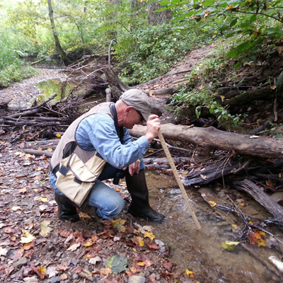 man observing a stream